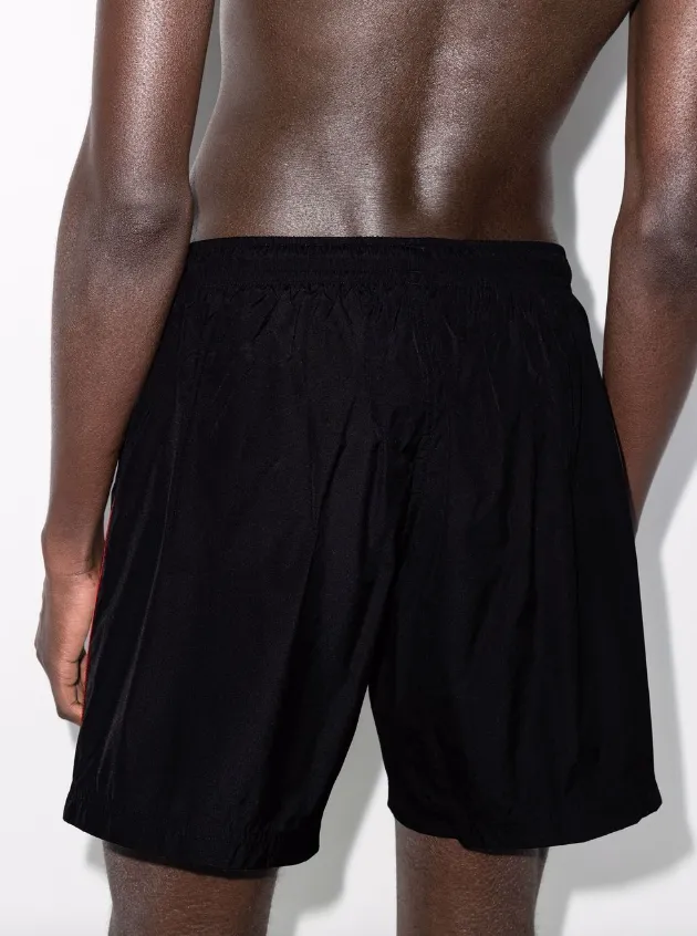 Alexander McQueen selvedge logo-jacquard swim shorts